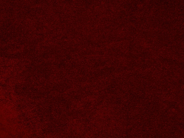 Textura de tela de terciopelo rojo utilizada como fondo Fondo de tela roja vacía de material textil suave y liso Hay espacio para texto