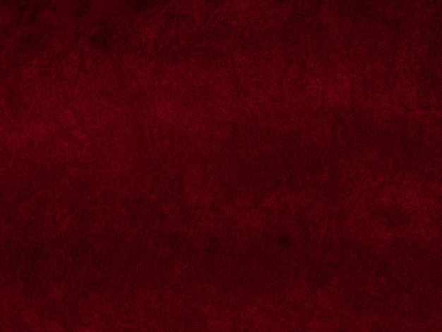 Textura de tela de terciopelo rojo utilizada como fondo Fondo de tela roja vacía de material textil suave y liso Hay espacio para texto