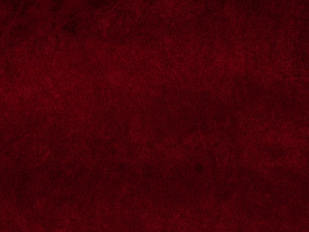 Textura de tela de terciopelo rojo utilizada como fondo Fondo de tela roja vacía de material textil suave y liso Hay espacio para texto