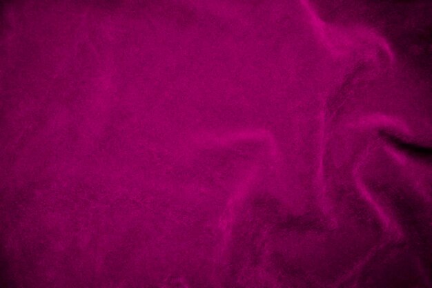 Textura de tela de terciopelo rosa utilizada como fondo Fondo de tela rosa de material textil suave y liso Hay espacio para texto