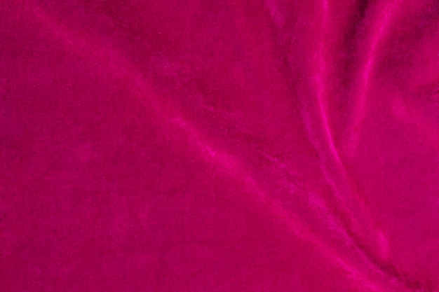 Textura de tela de terciopelo rosa utilizada como fondo fondo de tela rosa de material textil suave y liso Hay espacio para textx9