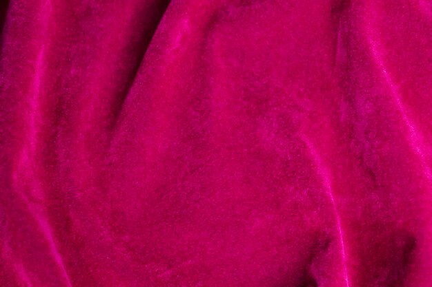 Foto textura de tela de terciopelo rosa utilizada como fondo fondo de tela rosa de material textil suave y liso hay espacio para textx9