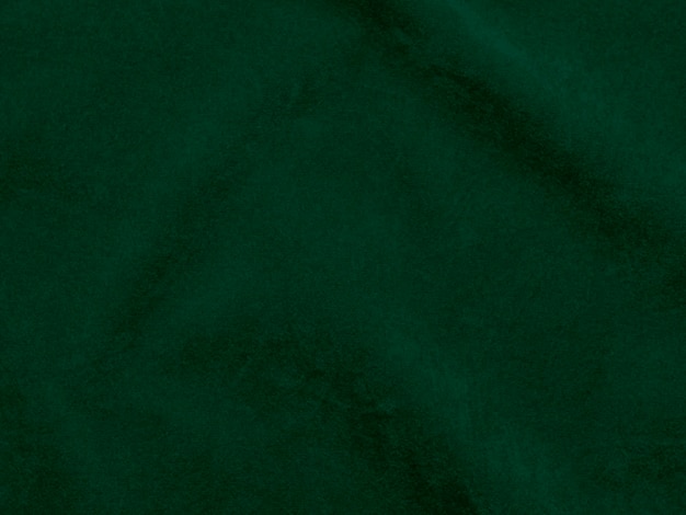 Textura de tela de terciopelo verde oscuro utilizada como fondo Fondo de tela verde vacío de material textil suave y liso Hay espacio para texto