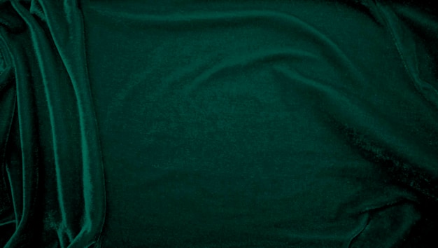 Foto textura de tela de terciopelo verde utilizada como fondo fondo de tela de panne de color pavo real de material textil suave y liso terciopelo triturado tono esmeralda de lujo para seda