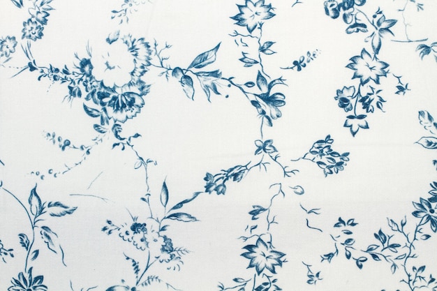 Una textura textil de flores azules en una vista cercana