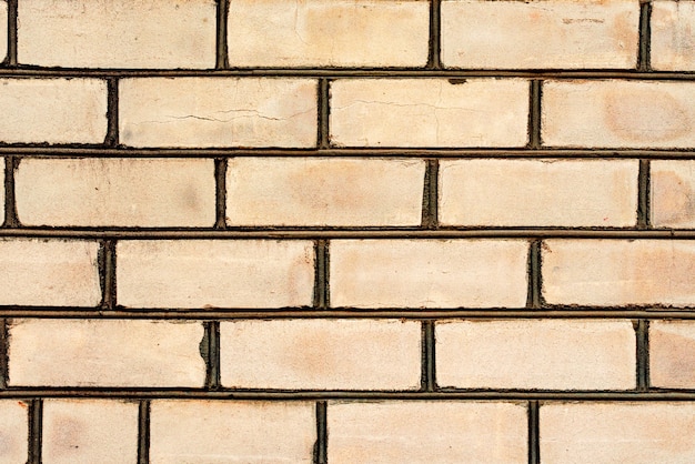 Textura, tijolo, fundo da parede. Textura de tijolo com arranhões e rachaduras