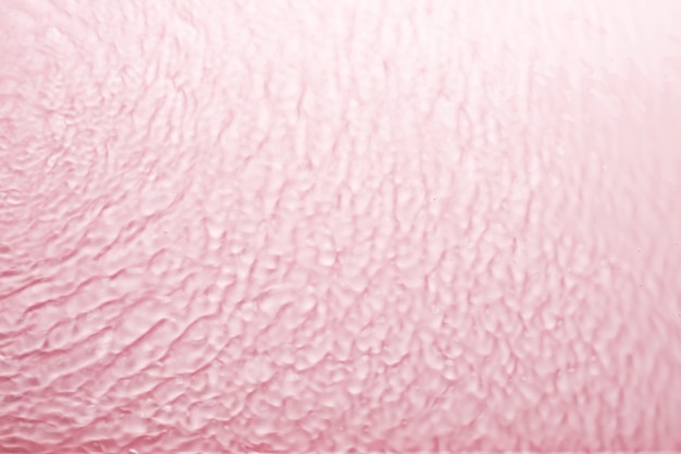 Textura transparente rosa de la superficie del agua. Fondo abstracto de moda.