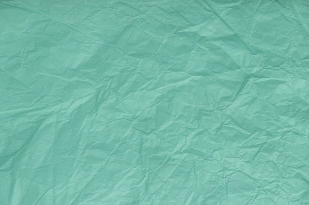 Textura de turquesa arrugada, papel de regalo, primer plano. Verde viejo