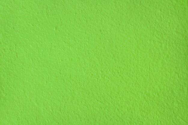 Textura verde da parede do cimento para o trabalho de arte do fundo e do projeto.