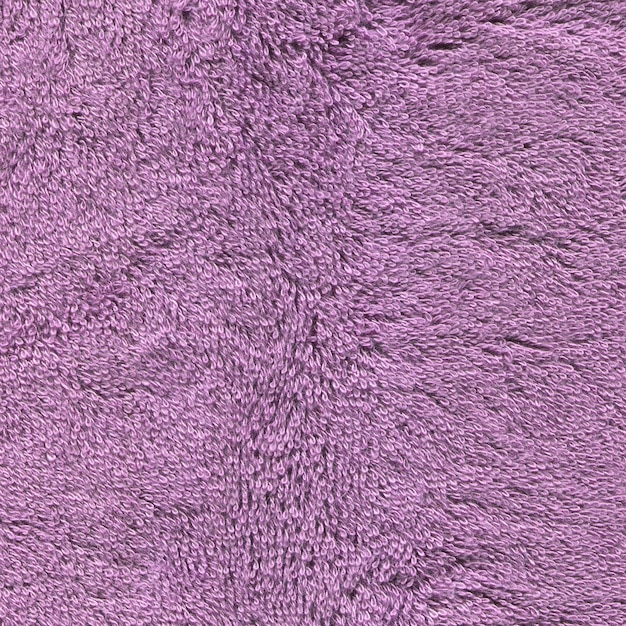 Textura violeta da toalha das fibras fundo violeta da toalha de banho