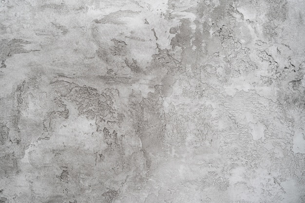 Textura de yeso gris sobre una pared blanca