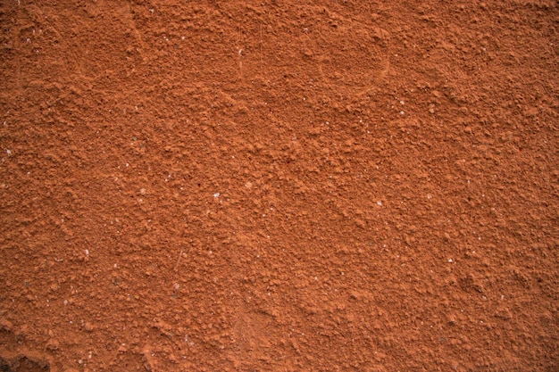 La textura de yeso rojo de la pared de ladrillo antiguo se puede utilizar como papel tapiz de fondo