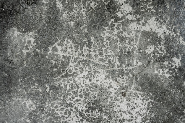 Texturas de fondo grietas y manchas oscuras de hormigón gris con manchas que el viejo pelado apreciado