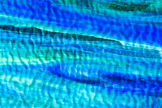 Foto texture a cor marinha azul do fundo do vitral com manchas da cor.