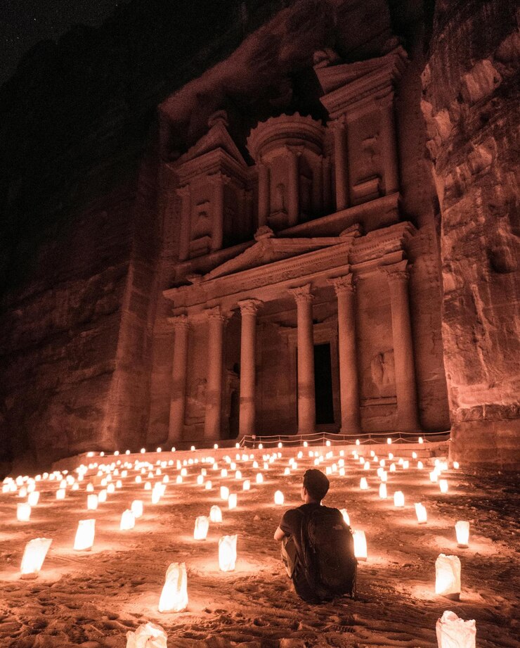 The Treasury Al-Khazneh at Petra illuminated by candlelight at night in Jordan