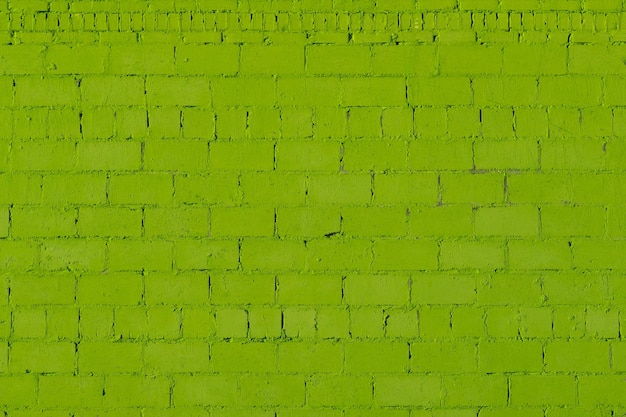 Tijolo áspero de gesso verde fora da textura da parede