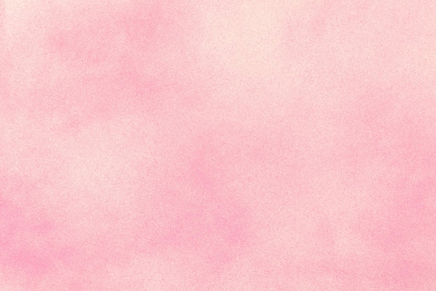 Tinta spray rosa sobre fundo de papel branco