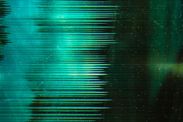 Foto tira de filme verde envelhecida textura angustiada arranhões de poeira na superfície brilhante escura