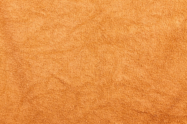 Toalha de banheiro laranja textura de fundo têxtil para design e decoração closeup extrema