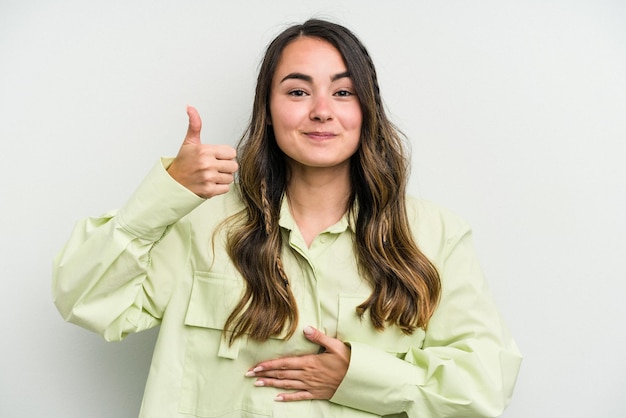 Foto toca la barriga sonríe comiendo suavemente y el concepto de satisfacción