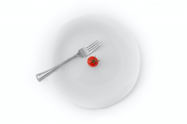 Tomate en un plato sobre un blanco