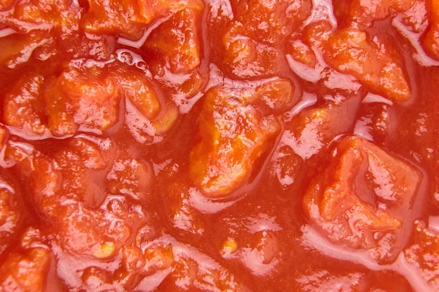 Tomates picados en fondo de comida de jugo de tomate