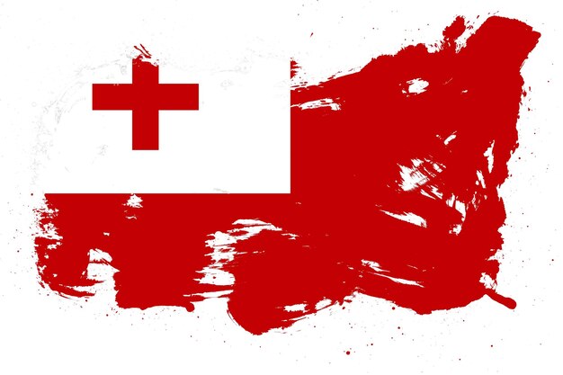 Foto tonga-flagge mit gemaltem schmutzpinselstricheffekt auf weißem hintergrund