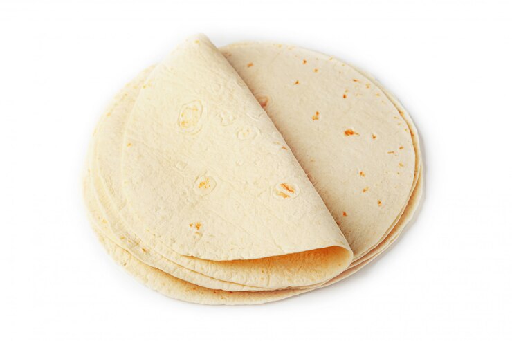 Foto tortilla. tortilla de milho ou simplesmente tortilla é um tipo de pão sem fermento fino feito de hominy.