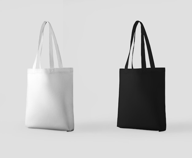 Totebag blanco negro con asa 3D de pie y aislado en el fondo