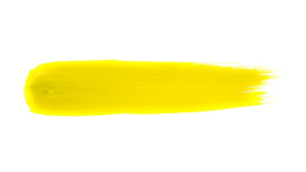 Traço de tinta acrílica amarela isolado em fundo branco conceito de arte abstrata