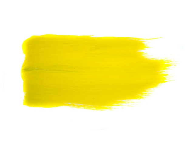 Traço de tinta acrílica amarela isolado em fundo branco conceito de arte abstrata