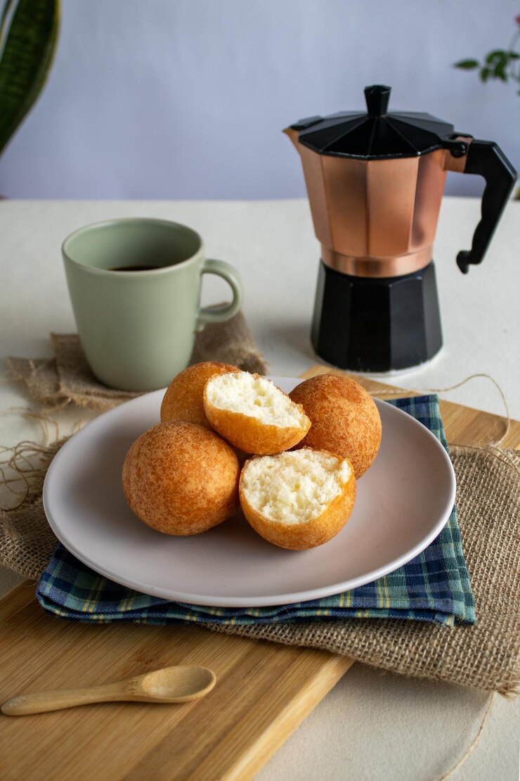 TRADITIONAL COLOMBIAN BREAKFAST BUNUELOS WITH COFFEE