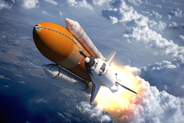 El transbordador espacial volando sobre las nubes