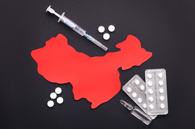 Tratamiento del coronavirus en China, mapa de China sobre una superficie negra