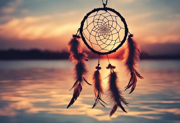 Foto traumfänger-sonnenuntergangshimmel-boho-chic-ethno-amulett-symbol für den tag der indigenen völker und der amerikanischen ureinwohner