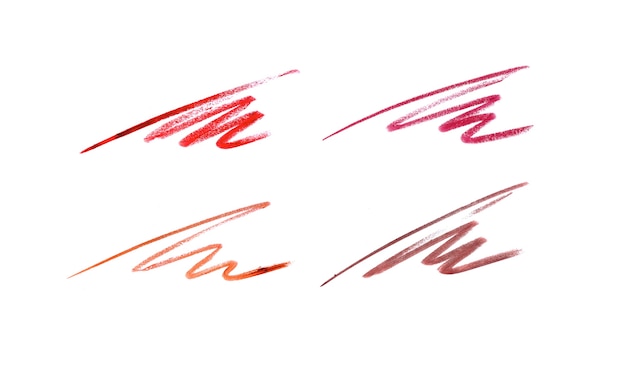 Trazos de lápiz labial en diferentes tonos en blanco