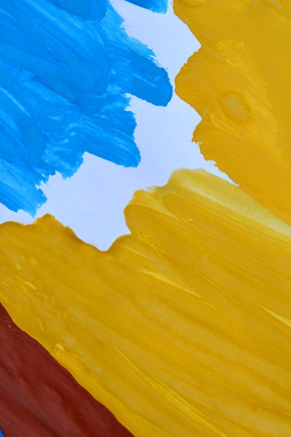 Trazos de pincel de fondo abstracto amarillo, marrón, papel blanco de tinta azul