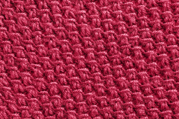 Foto trendfarbe des jahres 2023 strukturgemusterter strickstoff in der farbe viva magenta