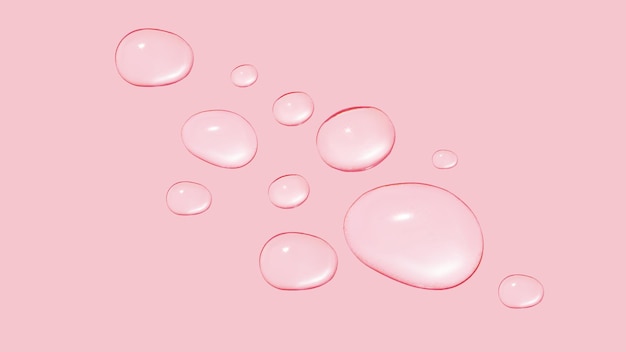 Tropfen aus transparentem Gel oder Wasser in verschiedenen Größen auf rosa Hintergrund