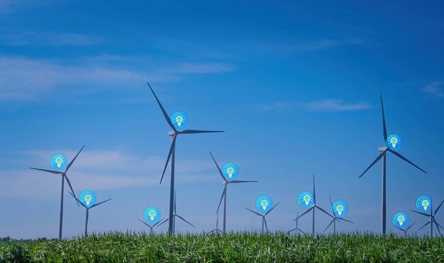 Foto turbinas de viento con luces azules en un campo con un cielo azul de fondo