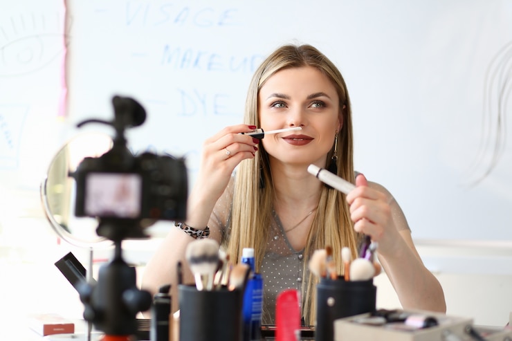 Foto tutorial femenino de video blogger streaming beauty