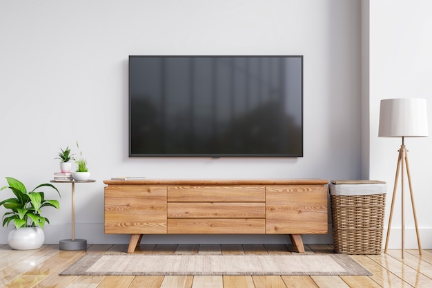 Foto tv auf dem schrank im modernen wohnzimmer auf weißer wand, 3d-rendering