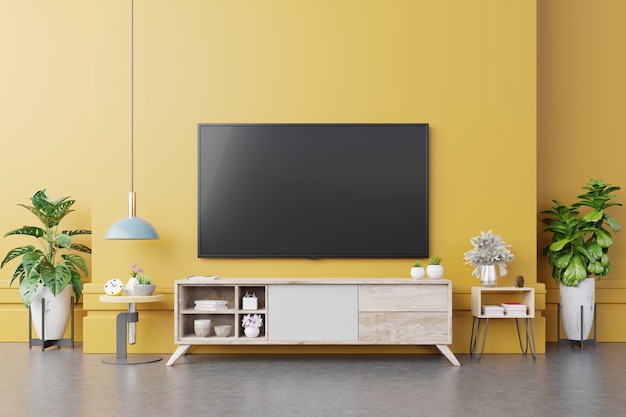 TV auf Kabinett im modernen Wohnzimmer mit Lampe, Tabelle, Blume und Pflanze auf gelbem Wandhintergrund, 3D-Darstellung