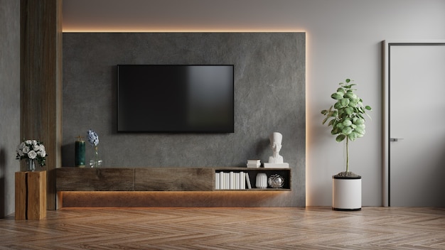 Foto tv montada na parede em uma sala escura com renderização 3d em parede de concreto
