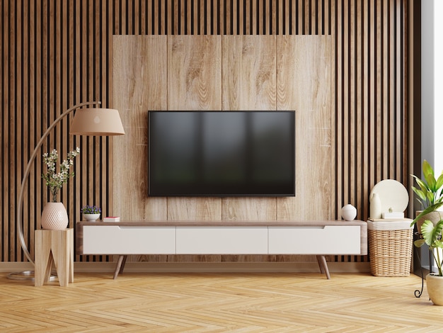 TV en el mueble en una habitación oscura con una pared de madera oscura. Representación 3D