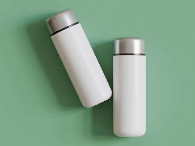 Two white thermos water bottles with silver lids on a green background