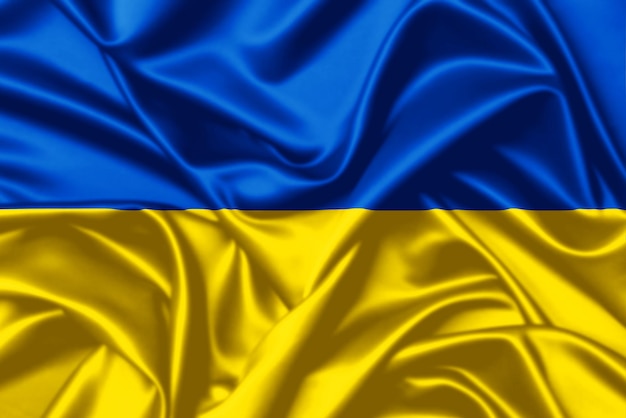 Ucrânia agitando bandeira fecha fundo de textura de cetim