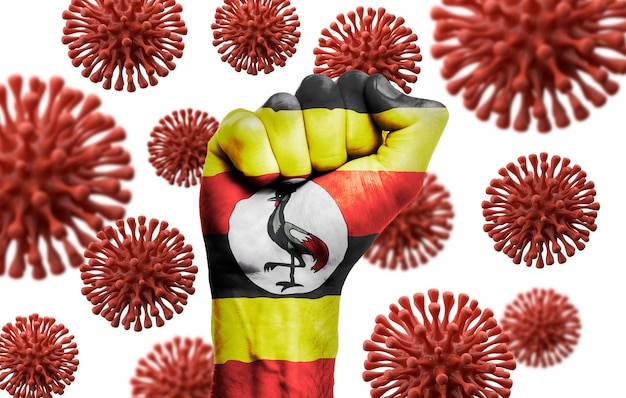 Uganda-Flaggenfaust im Kampf gegen die Coronavius-Krankheit