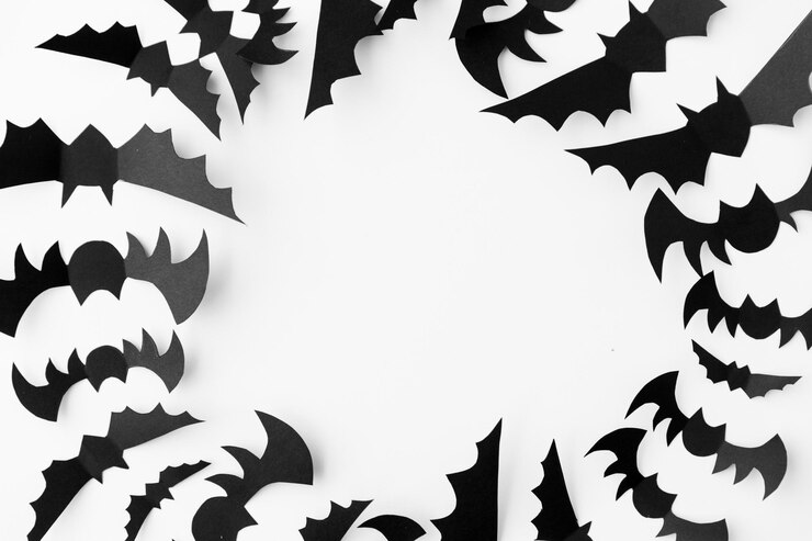 Foto um bando de morcegos de papel preto sobre um fundo branco
