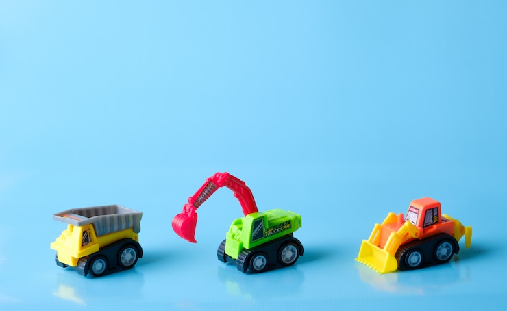 Foto um brinquedo de caminhão em um fundo azul